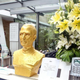 A golden bust of Steve Jobs displayed at a Shanghai Company